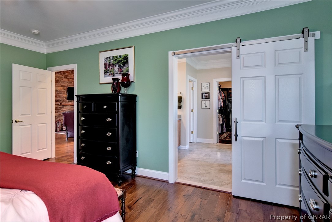 4205 Old Lock Road Williamsburg, VA 23188 - Photo 24 of 49 The master bedroom/bath is connected via a barn door.