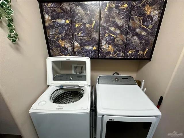 a utility room with dryer and washer