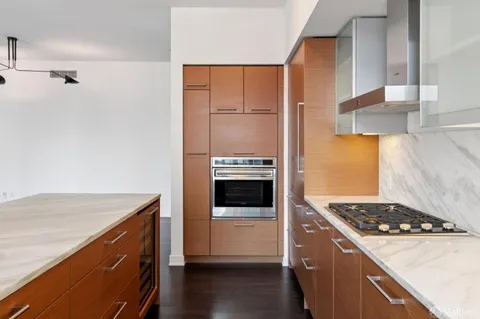 a kitchen with a stove and a refrigerator