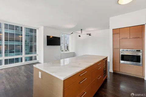 a kitchen with a stove and a refrigerator