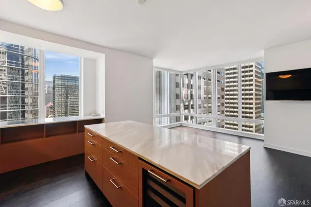 a room with pool table and windows