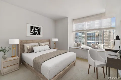 a bedroom with a bed and a large window