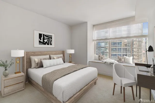 a bedroom with a bed and a large window