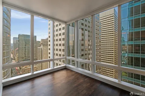 a view of a large living room with windows