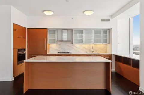 a view of kitchen with wooden floor