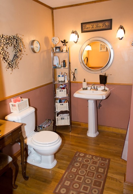 103 Chipaway Road Freetown, MA 02717 - Photo 12 of 26 a bathroom with a toilet a sink and mirror