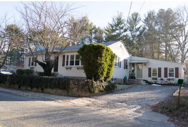 103 Chipaway Road Freetown, MA 02717 - Photo 2 of 26 a front view of a house with garden