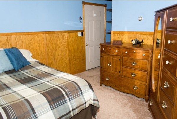 103 Chipaway Road Freetown, MA 02717 - Photo 22 of 26 a bedroom with a bed and wooden floor