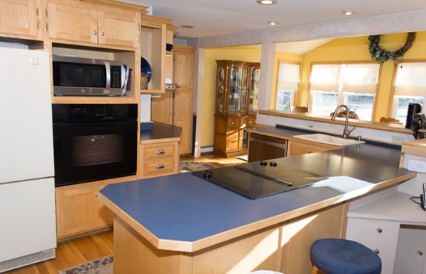 103 Chipaway Road Freetown, MA 02717 - Photo 5 of 26 a kitchen with a stove a sink and a microwave