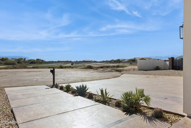 a living room with furniture a wooden floor and next to a window