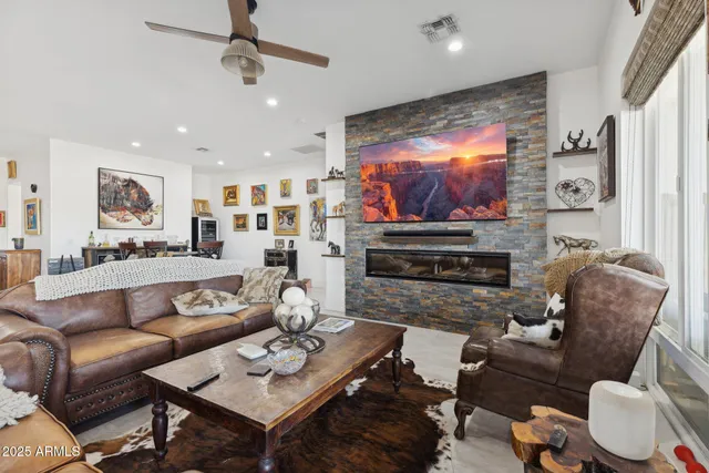 a kitchen with granite countertop a stove top oven microwave and cabinets