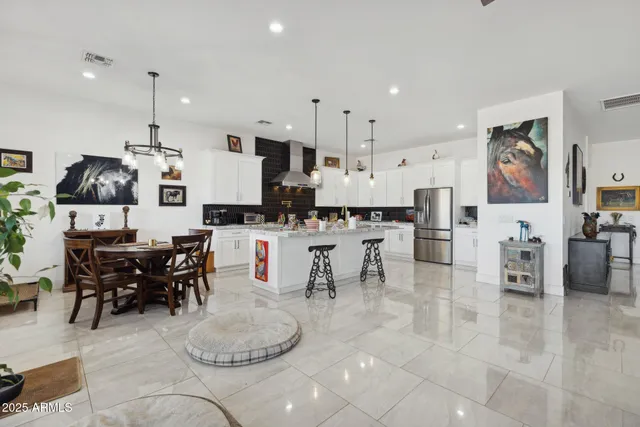 a living room with furniture a piano and a flat screen tv