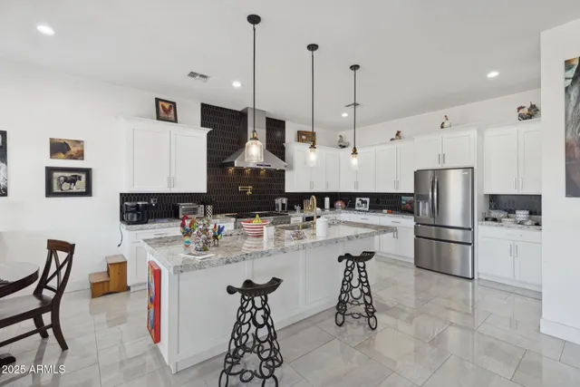 a bedroom with a bed a window and dresser