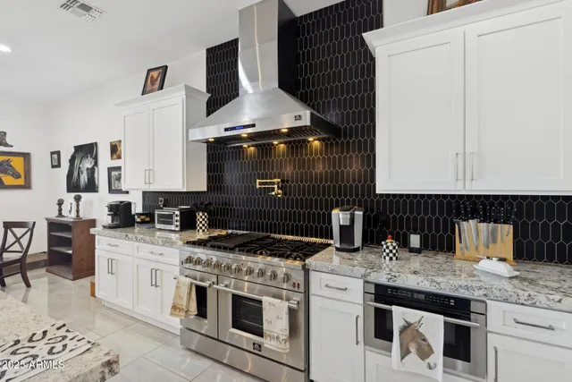 a large bathroom with a double vanity sink a mirror and a shower