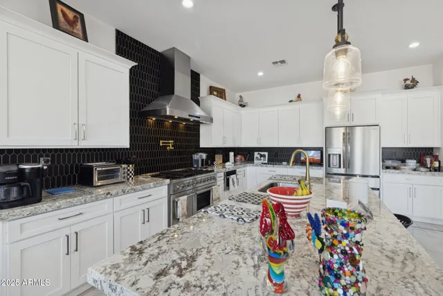 a bathroom with a granite countertop sink double and mirror