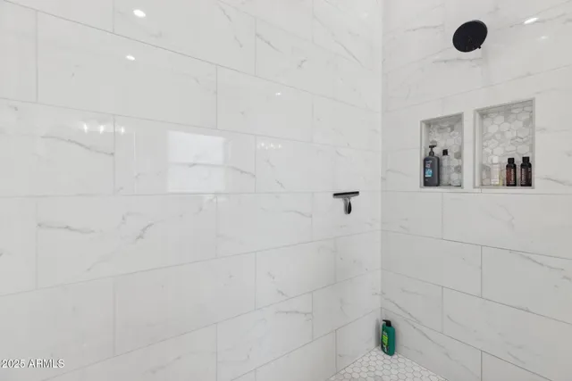 a view of swimming pool that has lawn chairs with wooden floor