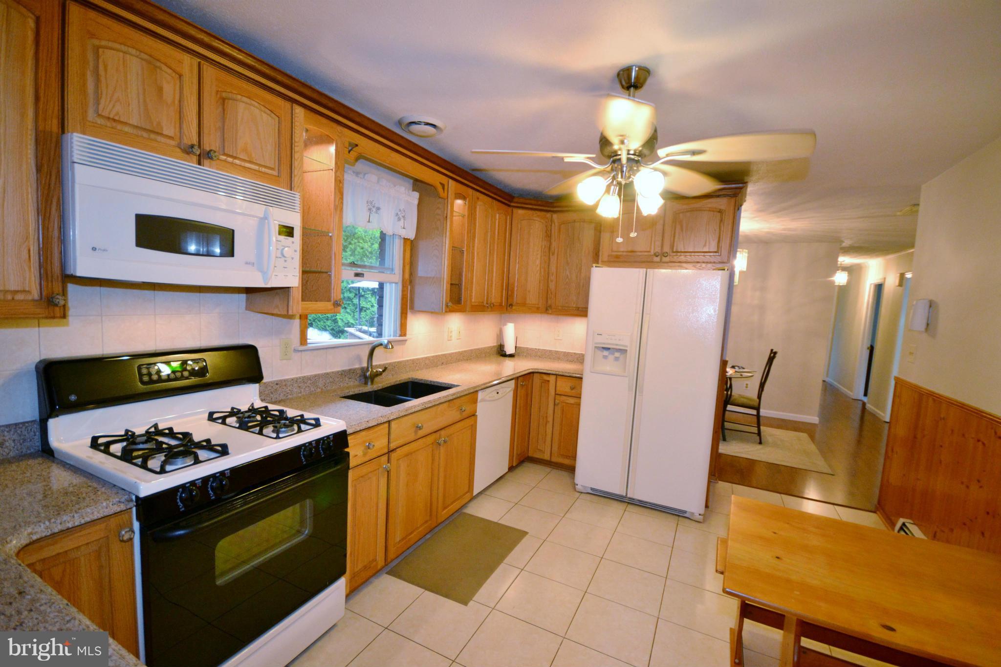 2714 Bachman Road Manchester, MD 21102 - Photo 2 of 30 Country kitchen has granite counters, tile floor