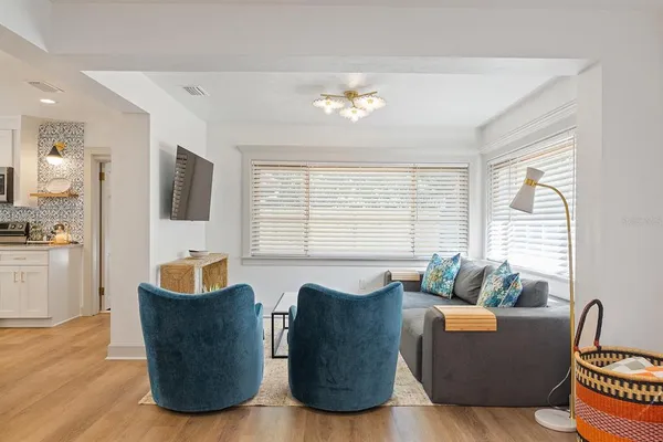 a living room with furniture and a large window