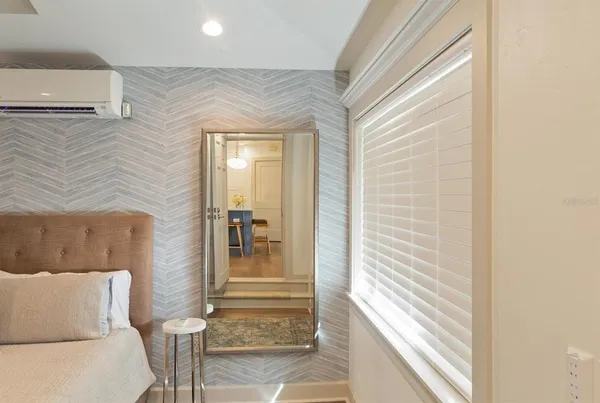 a view of a livingroom with furniture and staircase