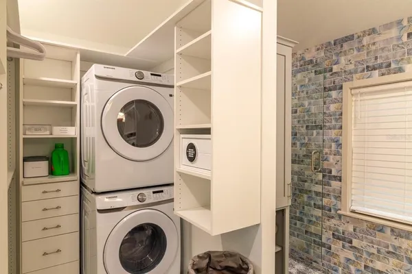 a view of a hallway with washer and dryer