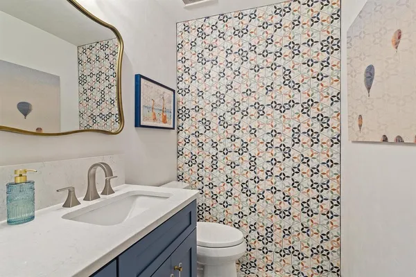 a bathroom with a sink and a toilet