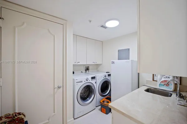 a utility room with dryer and washer