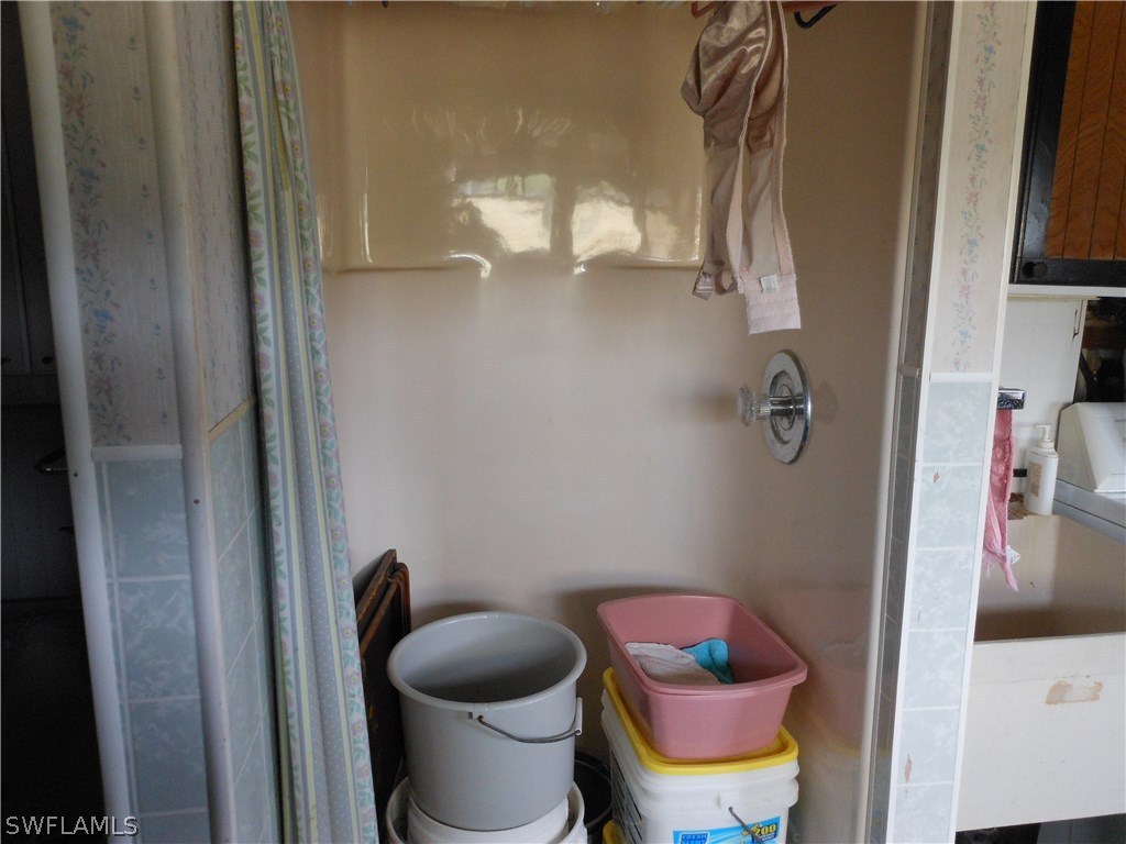 7664 Helen Road Bokeelia, FL 33922 - Photo 13 of 17 a bathroom with a toilet and a sink