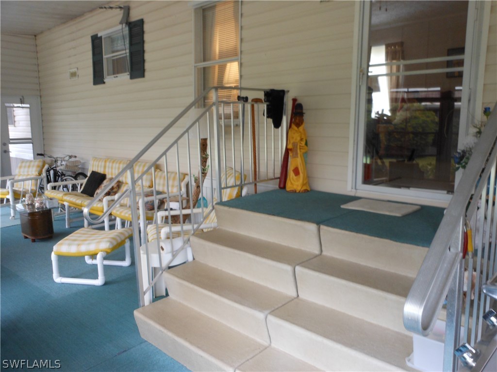 7664 Helen Road Bokeelia, FL 33922 - Photo 3 of 17 a view of entryway and hall with wooden floor