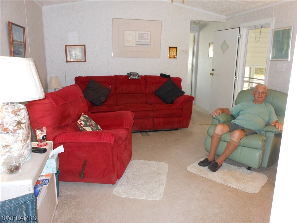 7664 Helen Road Bokeelia, FL 33922 - Photo 4 of 17 a living room with furniture