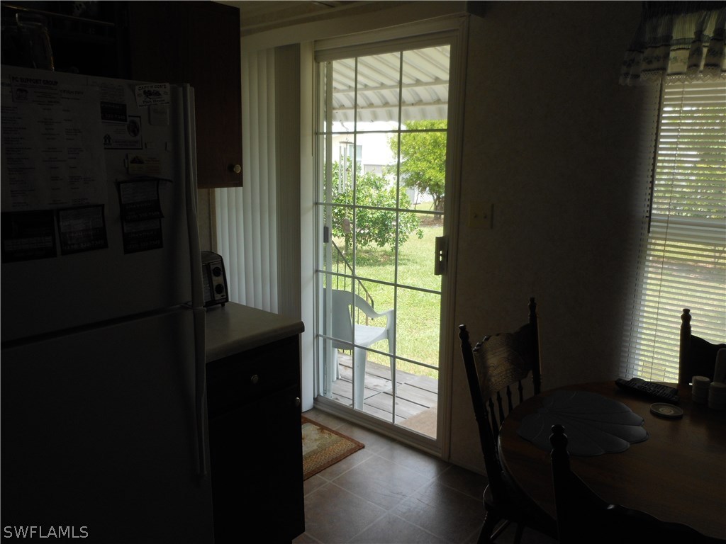 7664 Helen Road Bokeelia, FL 33922 - Photo 7 of 17 a room with a window and a bed