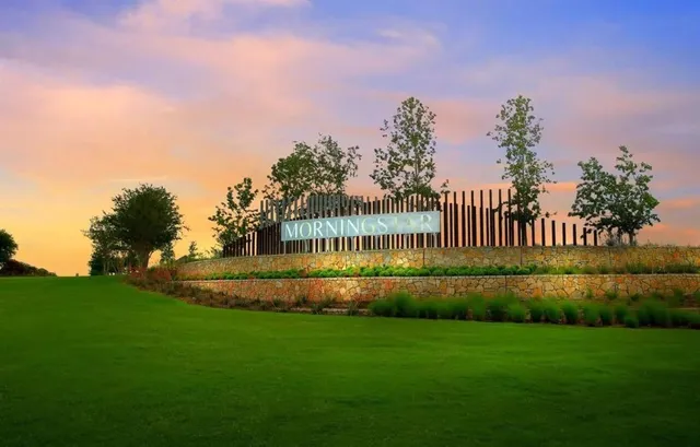 a view of a swimming pool with a yard