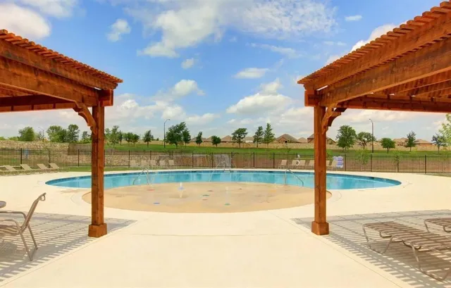 a view of a lake with houses in the background