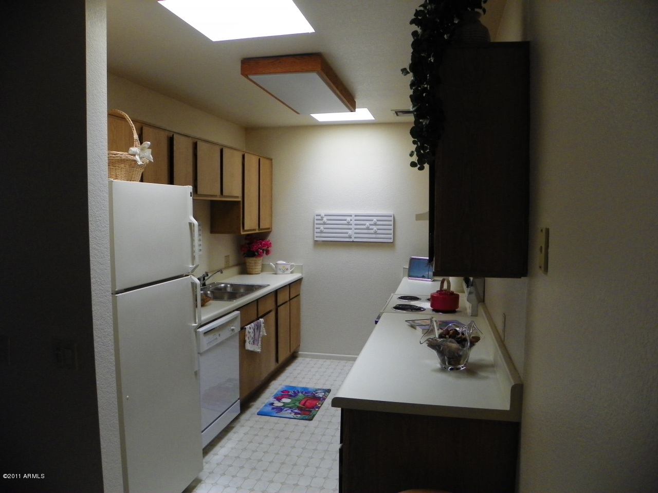 14300 West Bell Road, Unit 406 Surprise, AZ 85374 - Photo 8 of 15 Kitchen with dual sky lights
