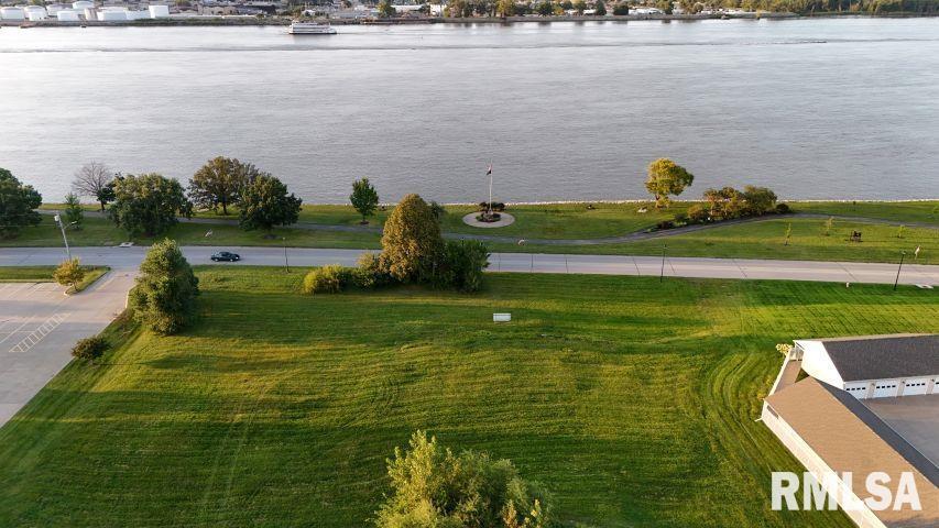 a view of a lake with a houses in the background