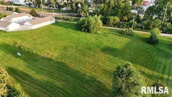 a view of a lake with a yard