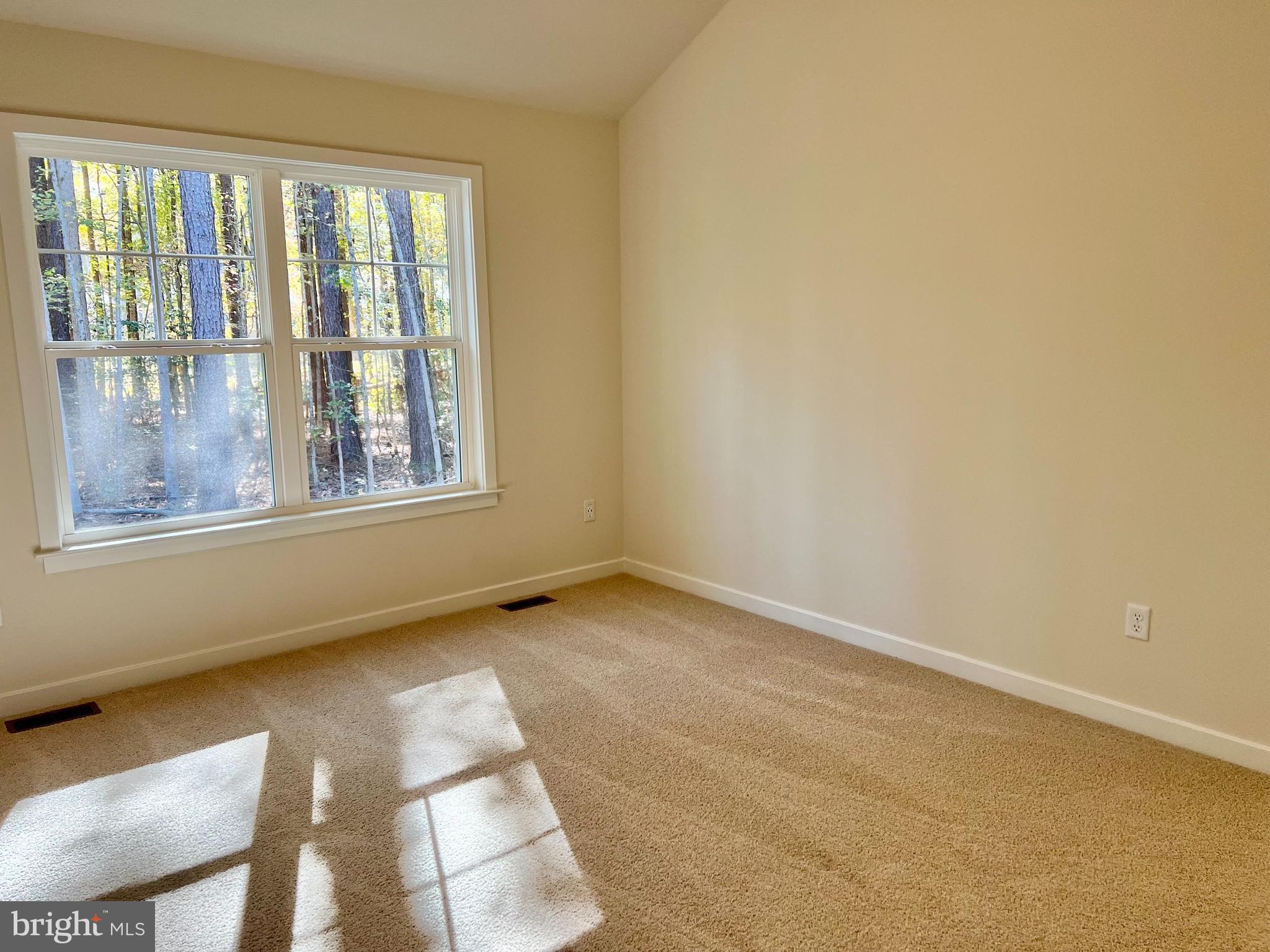 73 Azalea Way Colonial Beach, VA 22443 - Photo 12 of 13 a view of an empty room with a window
