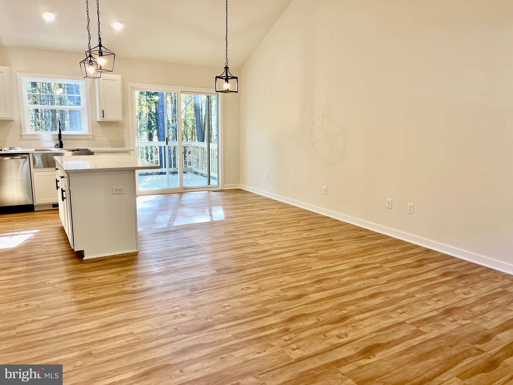 73 Azalea Way Colonial Beach, VA 22443 - Photo 6 of 13 a view of kitchen with granite countertop cabinets and wooden floor
