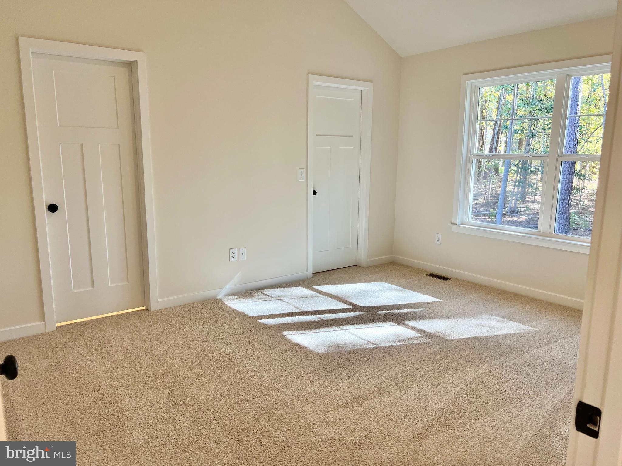 73 Azalea Way Colonial Beach, VA 22443 - Photo 8 of 13 a view of a livingroom with wooden floor and a window