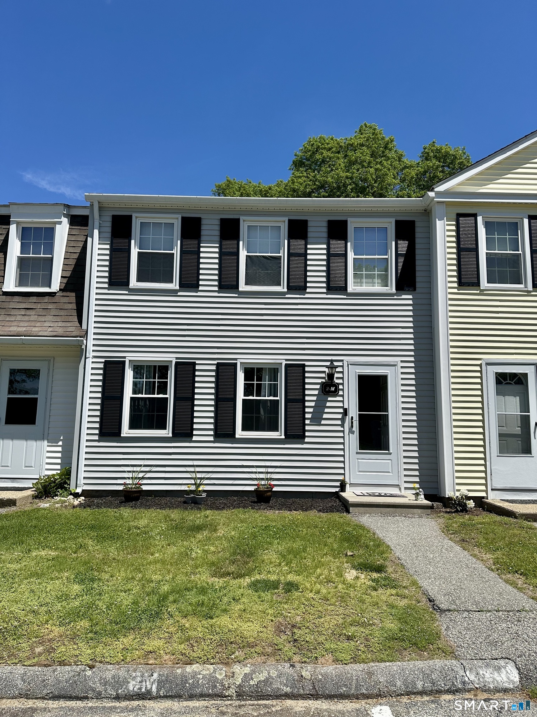 2 Lakeside Drive, Unit M Ledyard, CT 06339 - Photo 1 of 38 a front view of a house with a yard