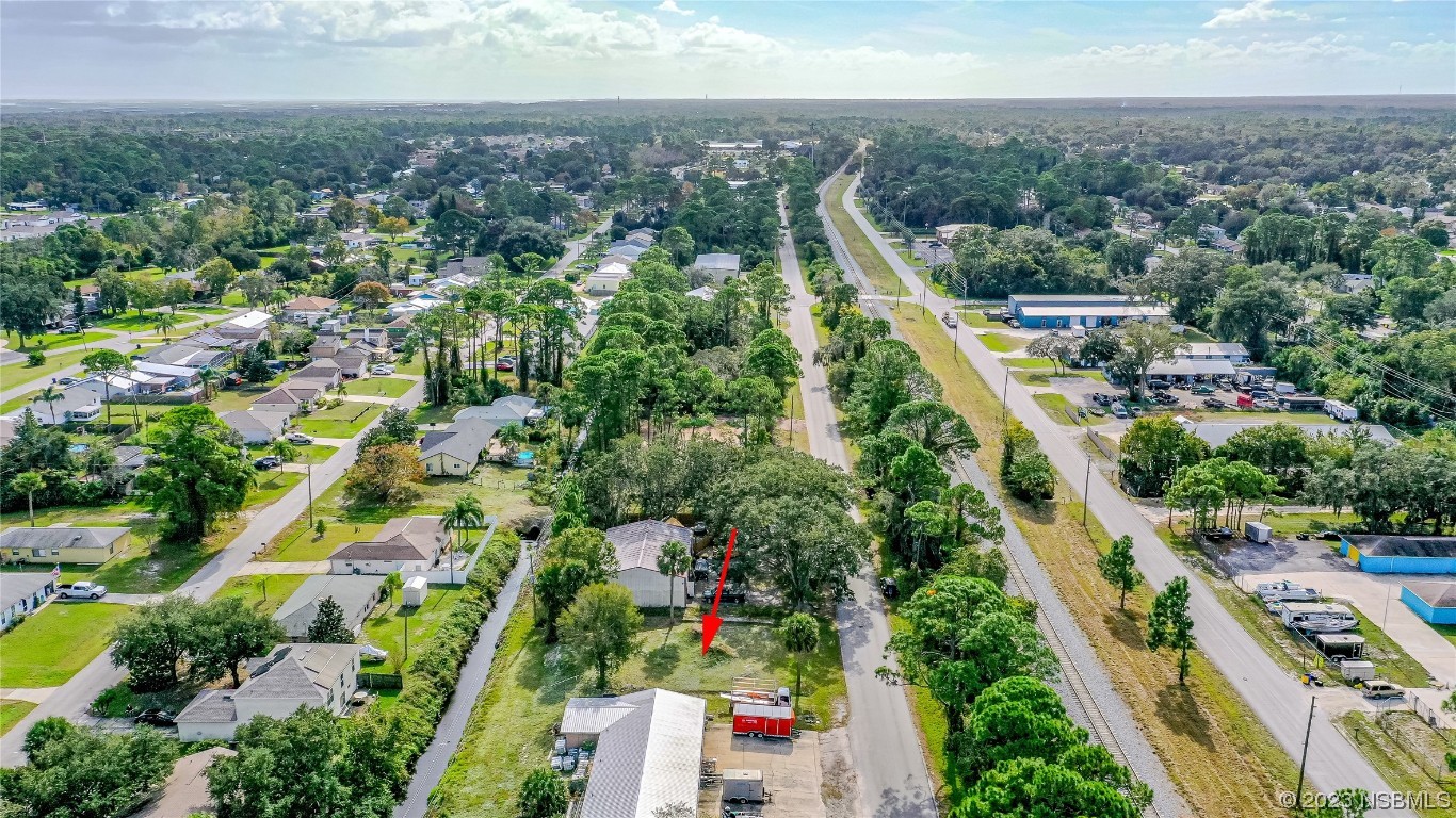 2421 Guava Drive Edgewater, FL 32141 - Photo 12 of 15 an aerial view of residential houses with outdoor space and trees