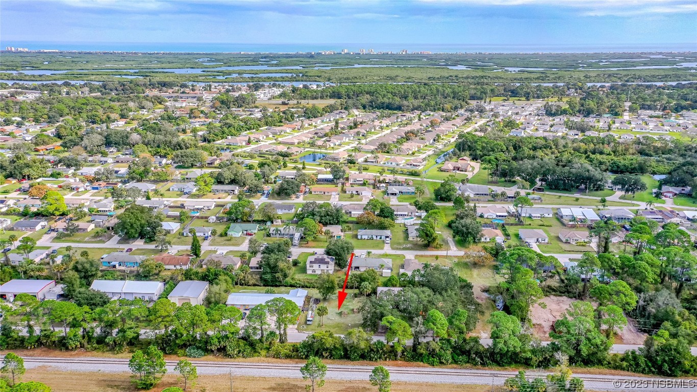 2421 Guava Drive Edgewater, FL 32141 - Photo 13 of 15 an aerial view of residential house with outdoor space and trees