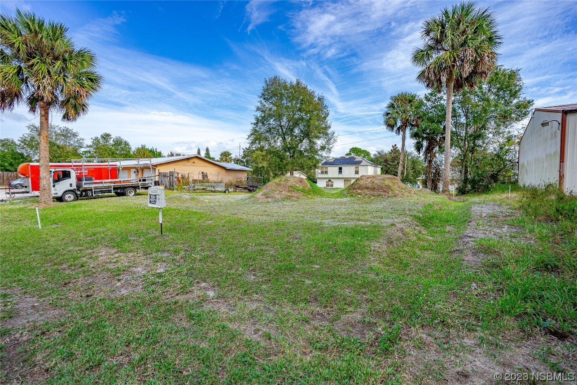 2421 Guava Drive Edgewater, FL 32141 - Photo 5 of 15 a view of an outdoor space and a yard