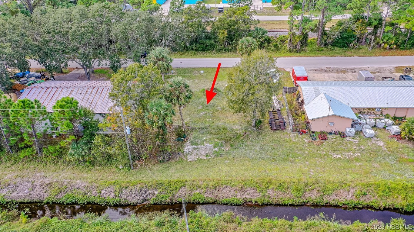 2421 Guava Drive Edgewater, FL 32141 - Photo 10 of 15 an aerial view of residential house with pool and yard