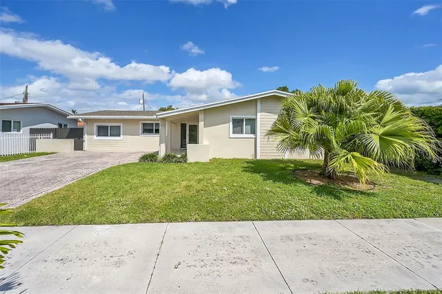 a view of backyard with a garden and plants