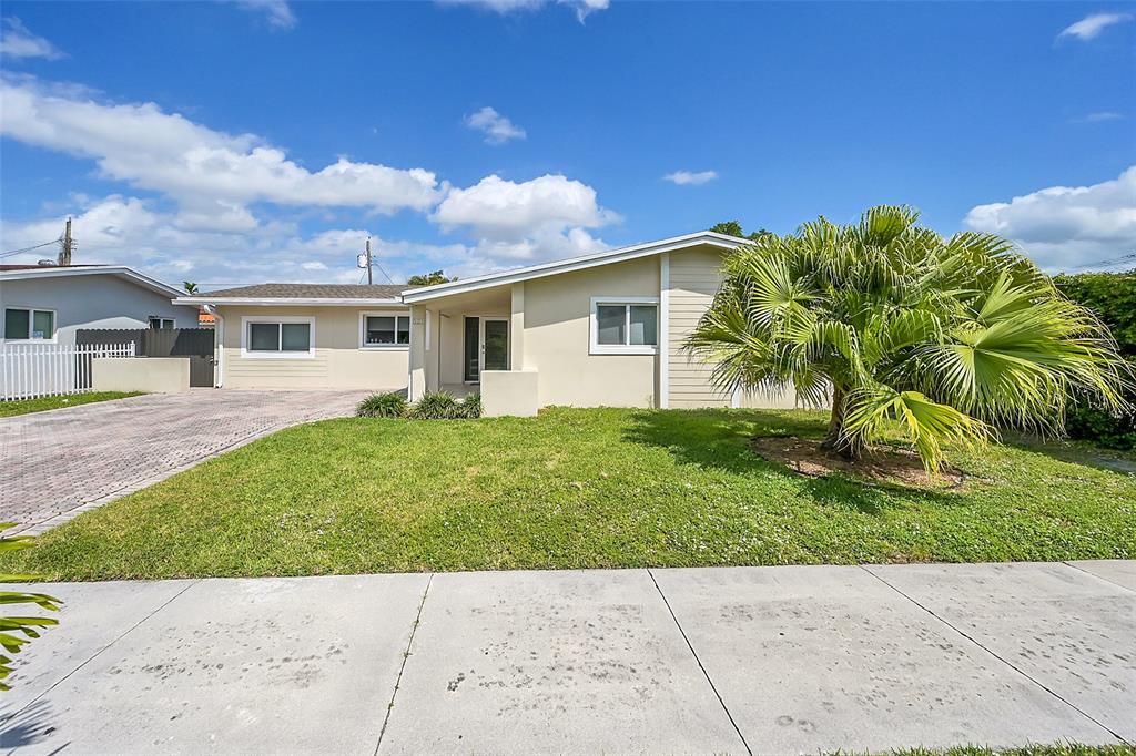 a view of backyard with a garden and plants