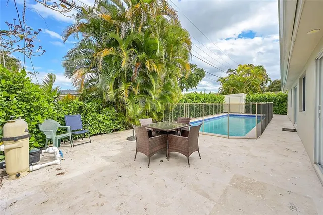 a view of a patio with a table and chairs in patio