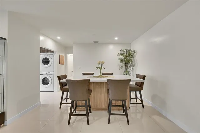 a view of a dining room with furniture and window