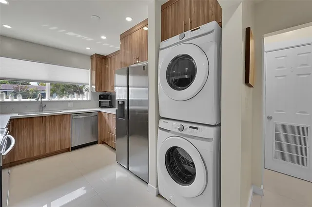 a kitchen with a washer and dryer