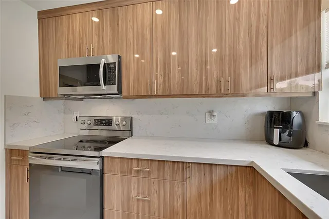 a kitchen with a stove and a microwave