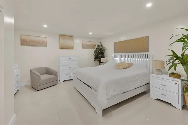 a bedroom with a bed and a couch